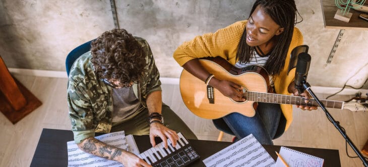Two people having fun while composing new songs