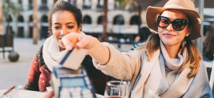 Woman paying in restaurant