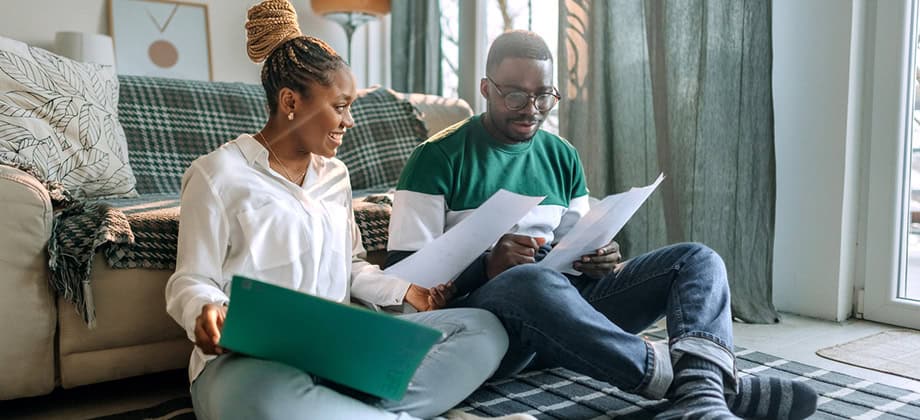 Young couple reviewing bills.