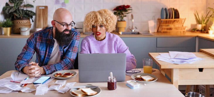 Couple organizing their taxes at home