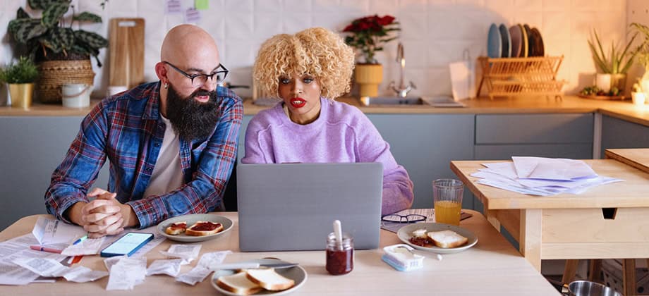 Couple organizing their taxes at home