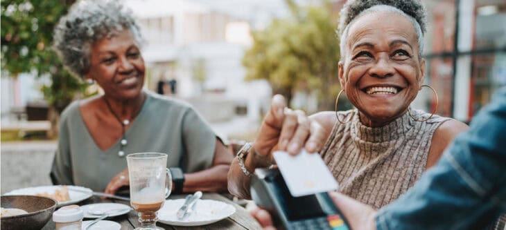 Senior woman making credit card payment